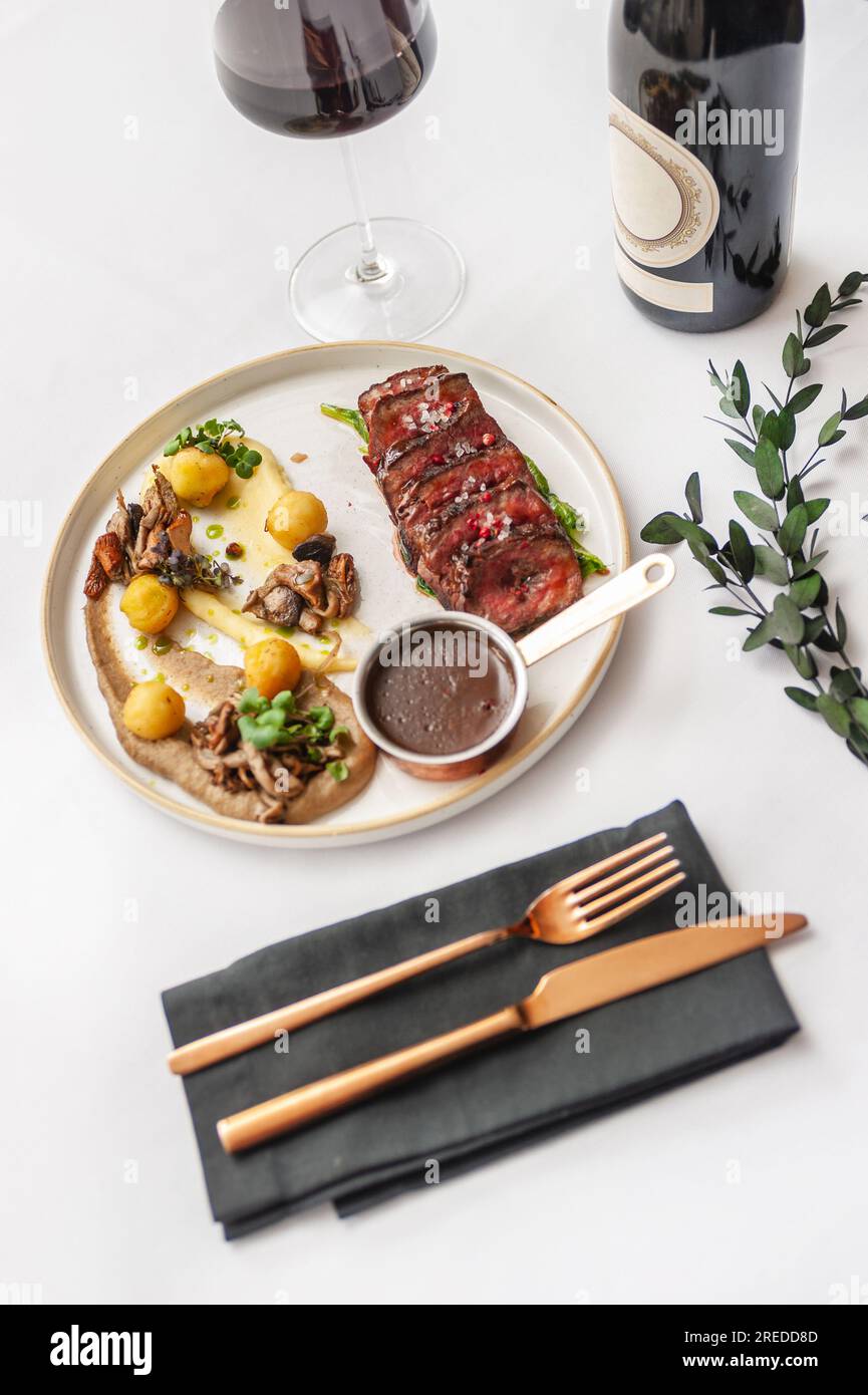 Beef steak with mushrooms and potatoes with demiglace sauce Stock Photo Alamy