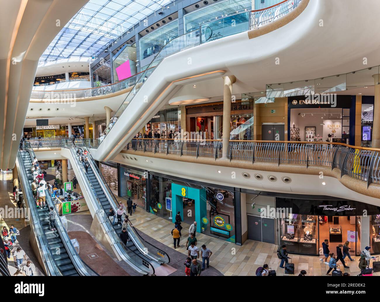 Busy scene with shoppers on escalators inside the Bullring Shopping ...