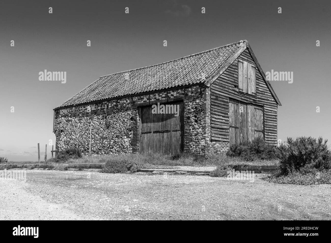 T'he coal shed'disused for storage when coal was brought up the rivers at high tide from the coast on barges for the local thornham inhabitants . Stock Photo