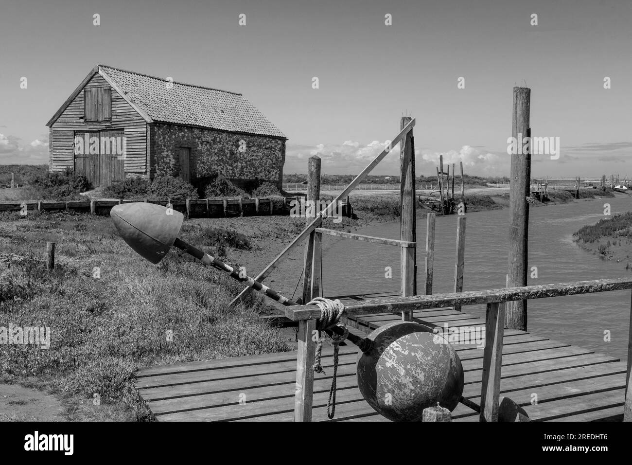 T'he coal shed'disused for storage when coal was brought up the rivers at high tide from the coast on barges for the local thornham inhabitants . Stock Photo