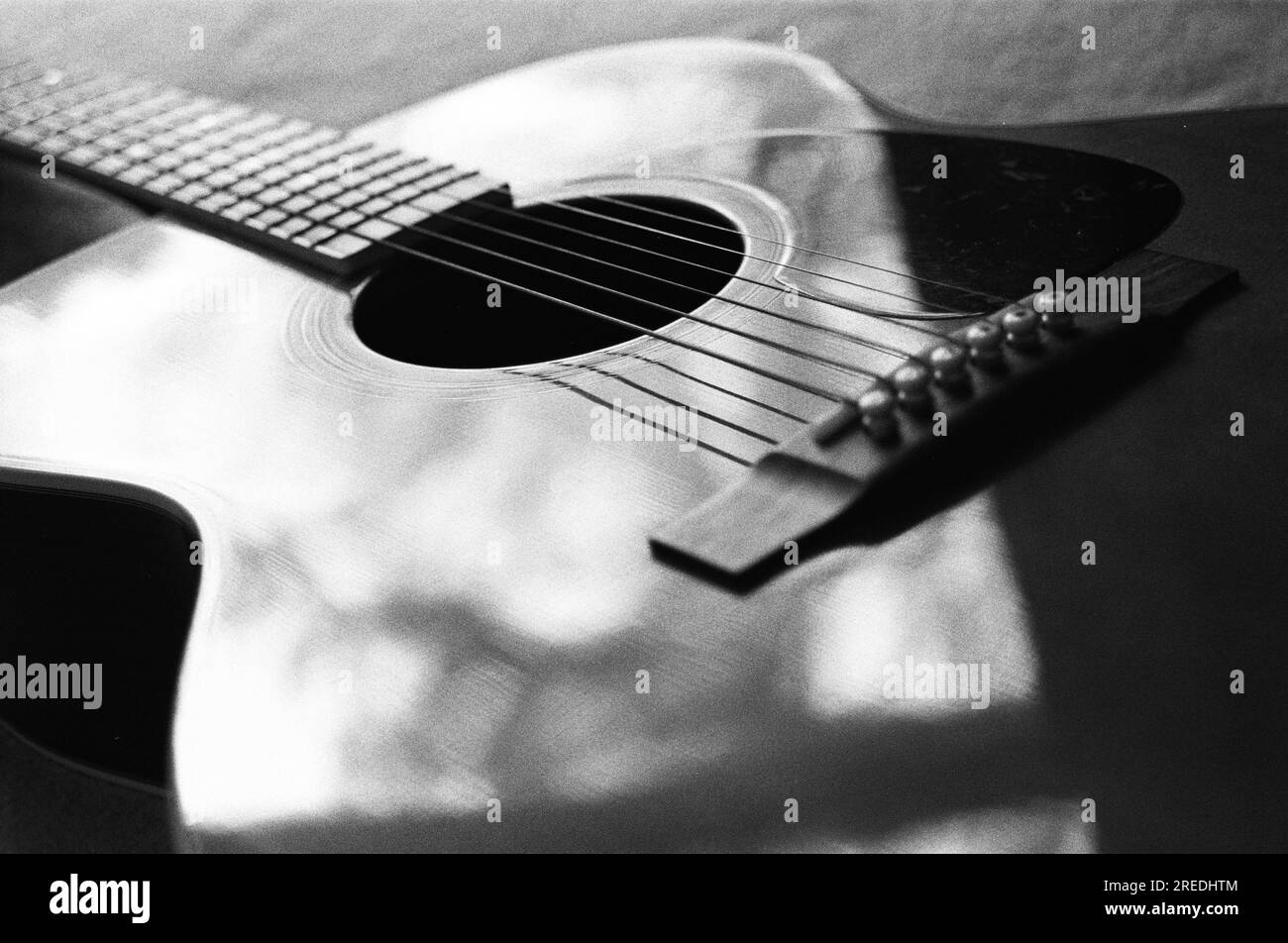 Acoustic guitar photographed on 35mm film Stock Photo