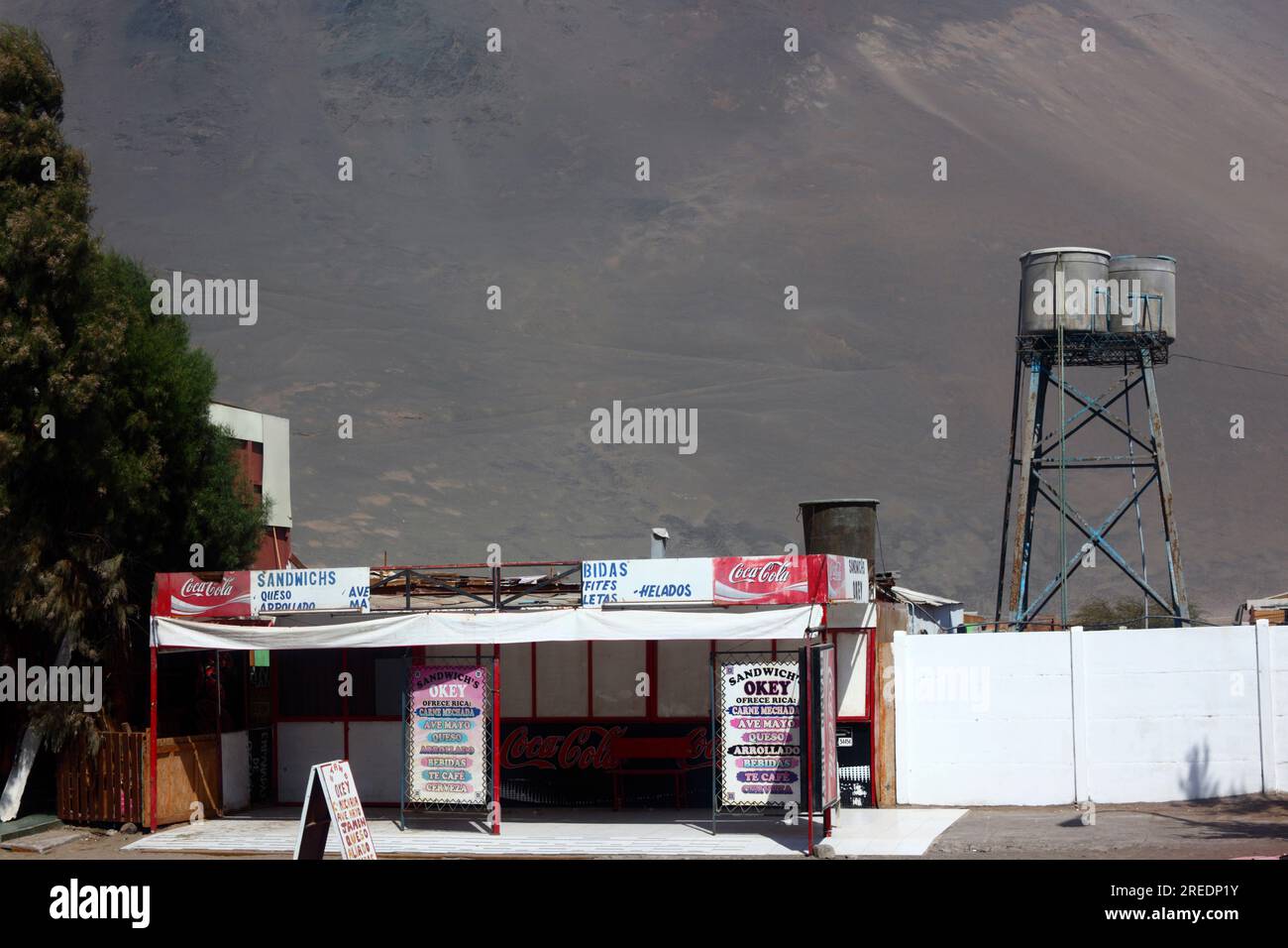 Food kiosk and water storage tanks at customs control post on Ruta 5 Pan-American highway, Cuya, Chile Stock Photo
