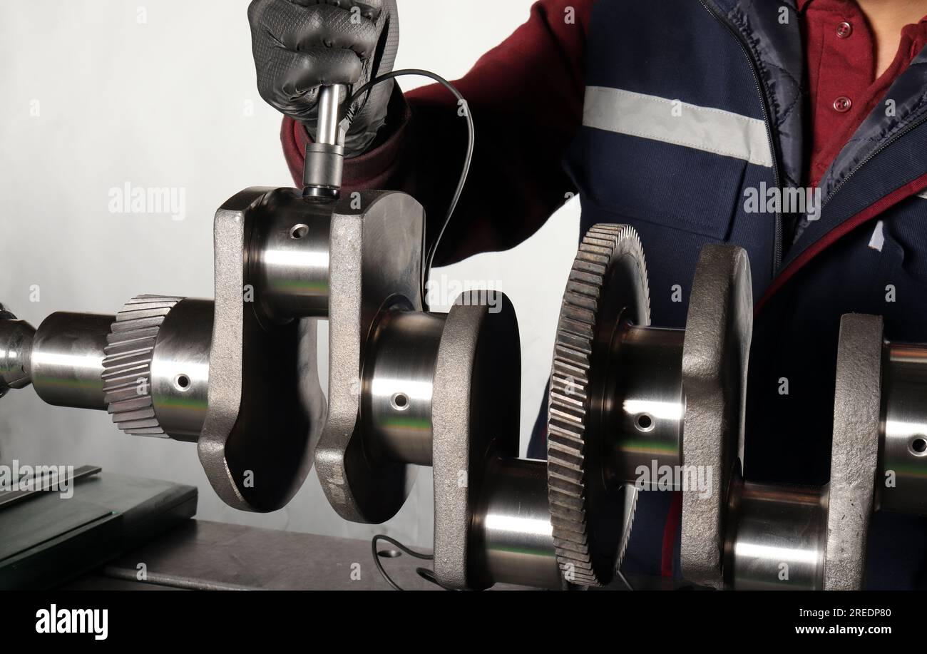 Master makes metal hardness measurement. Crankshaft Stock Photo Alamy