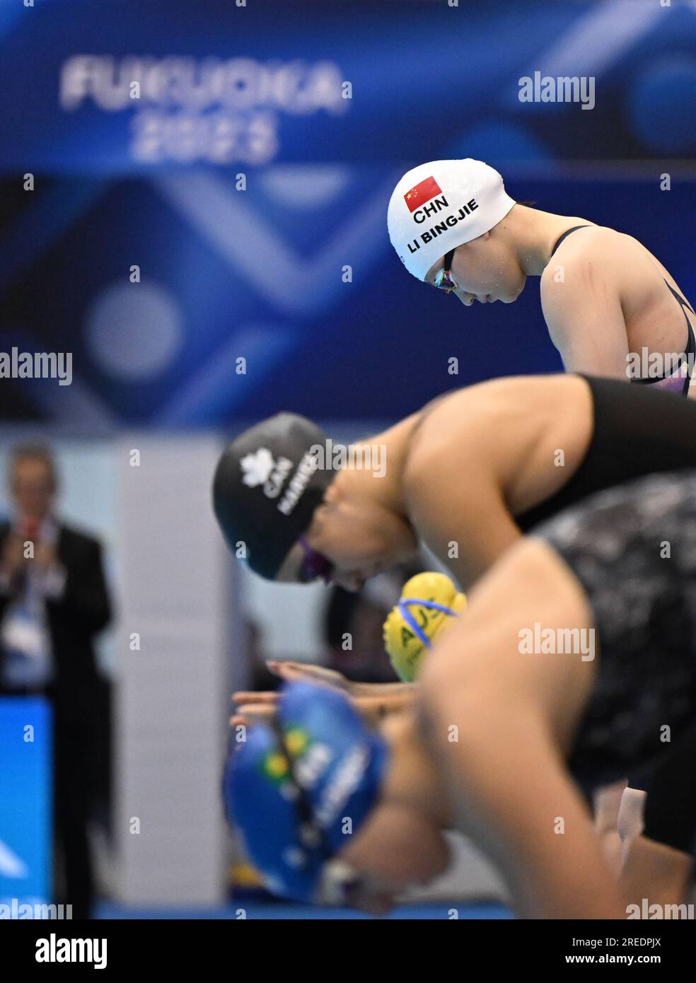 Fukuoka. 27th July, 2023. Li Bingjie (top) of Team China reacts before ...