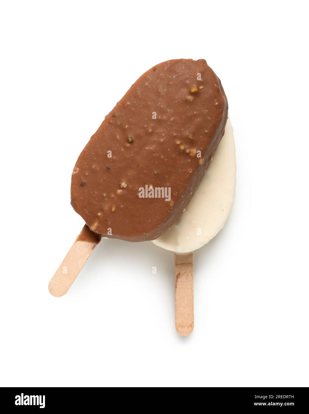 Different chocolate covered ice cream on stick against white background