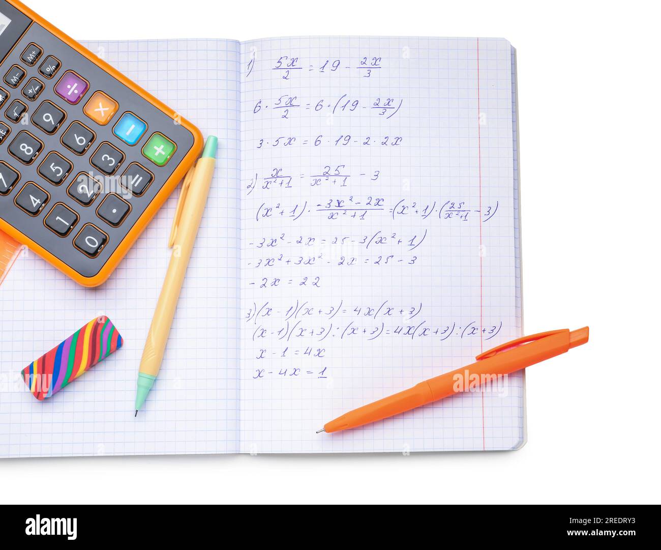 Copybook with maths formulas, calculator and stationery isolated on