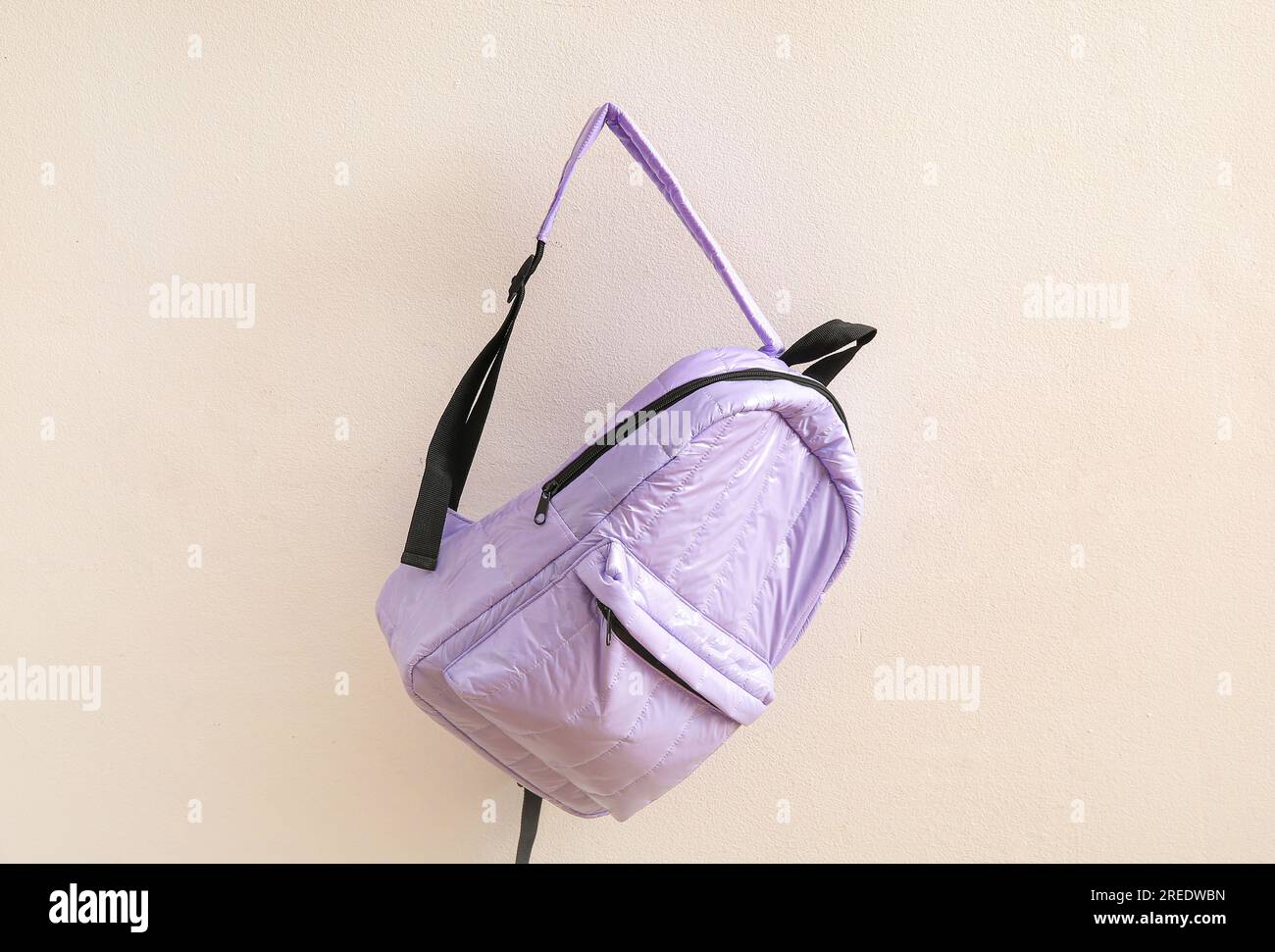 Lilac school backpack on light background Stock Photo