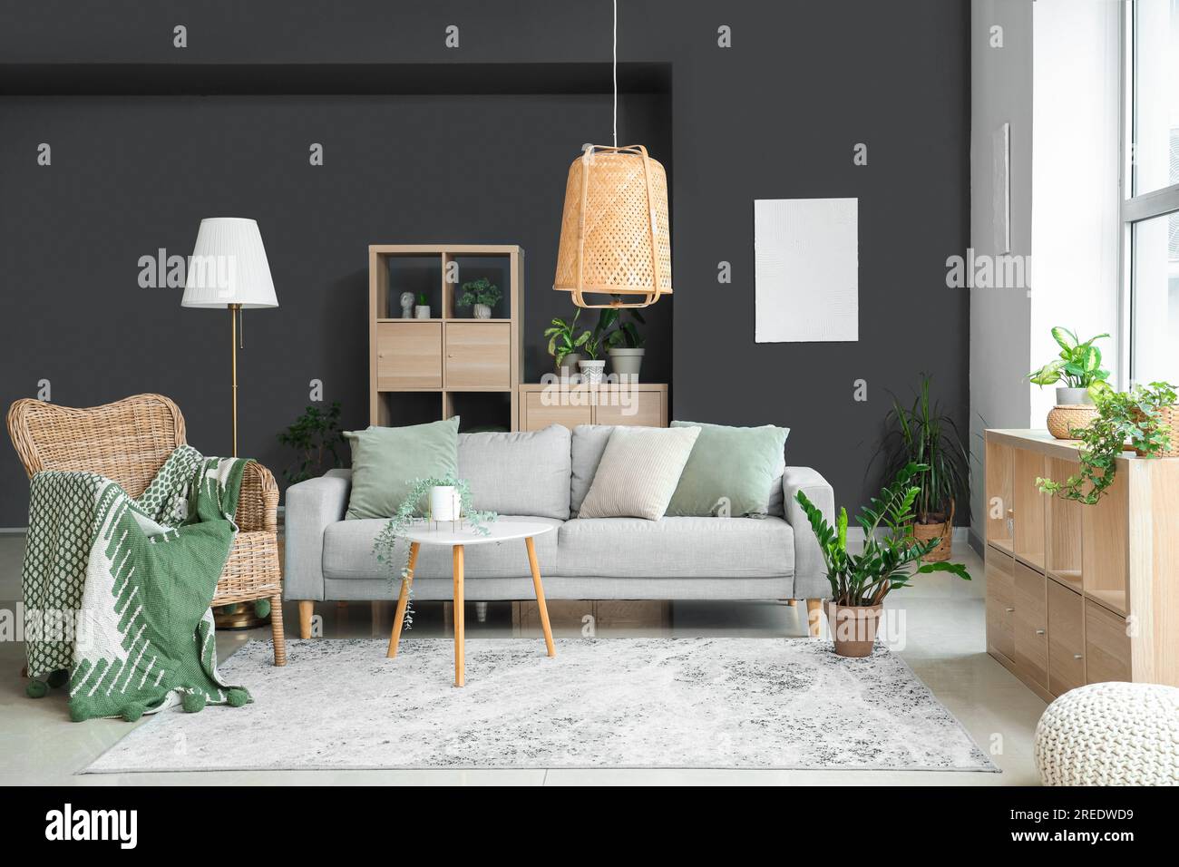 Interior of modern living room with plants, sofa and armchair Stock ...