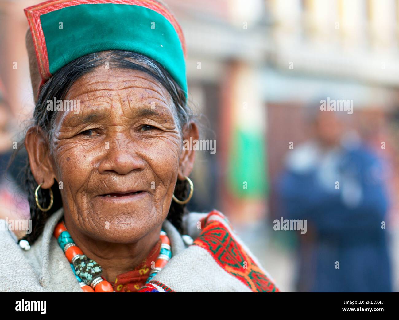 A Himachali woman in traditional clothes at Boudhanath Stupa, Kathmandu, Nepal Stock Photo