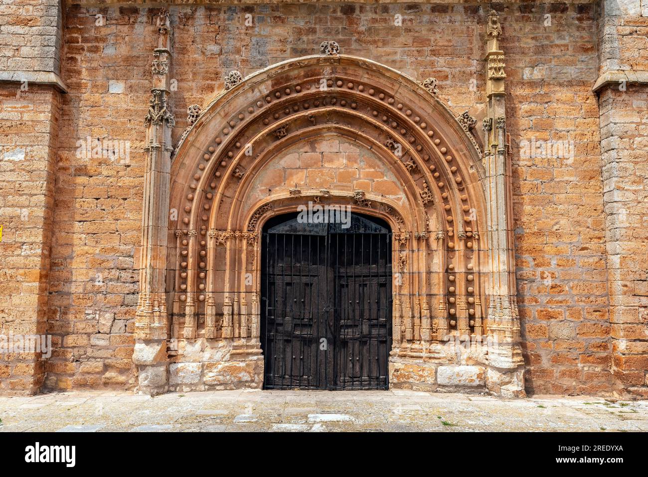 Portal of Nuestra Señora de la Asunción collegiate church (13th-18th century) rebuilt in 1440 in the Lombard-Gothic style, The church is placed in the Stock Photo