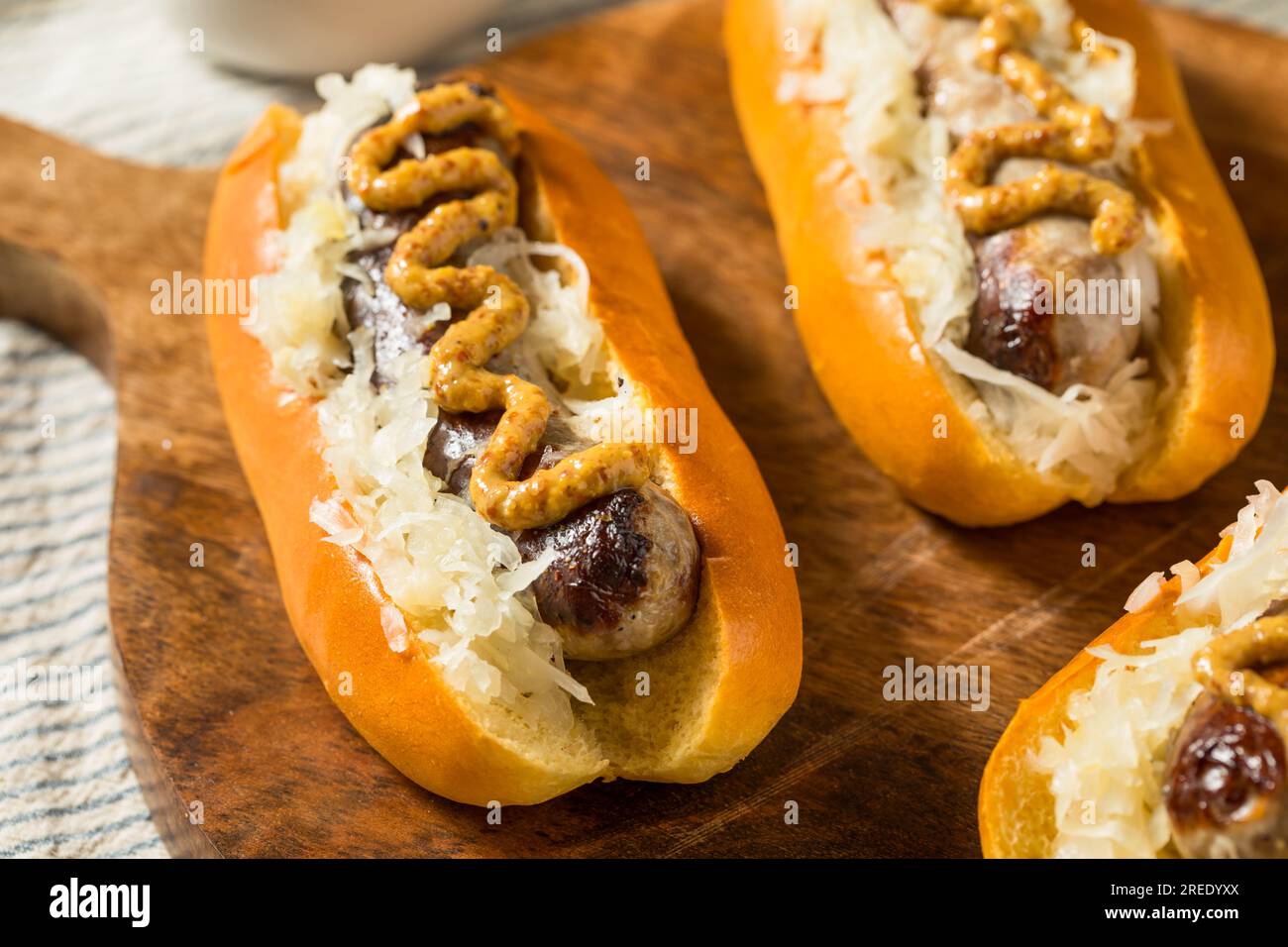 Homemade German Bratwurst Sausage with Mustard and Sauerkraut Stock