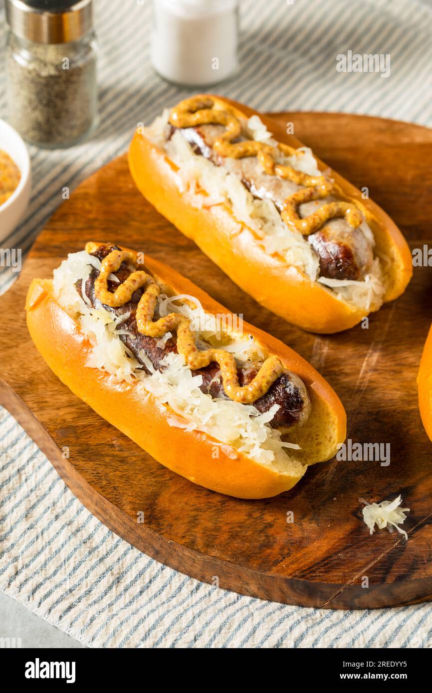 Homemade German Bratwurst Sausage with Mustard and Sauerkraut Stock