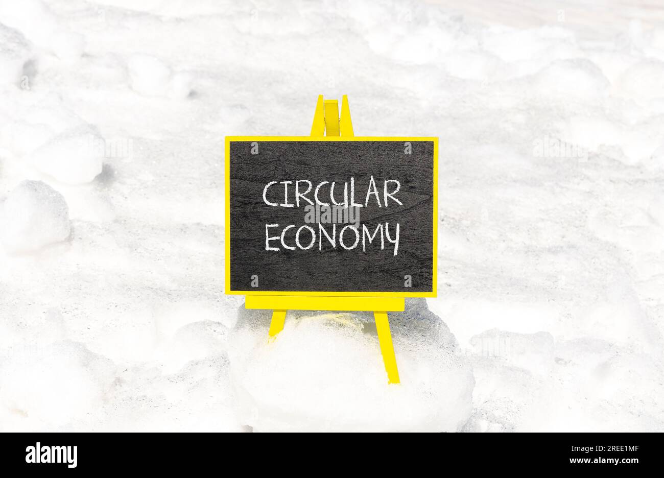 Circular economy symbol. Concept words Circular economy on beautiful black blackboard. Beautiful snow background. Business circular economy concept. C Stock Photo