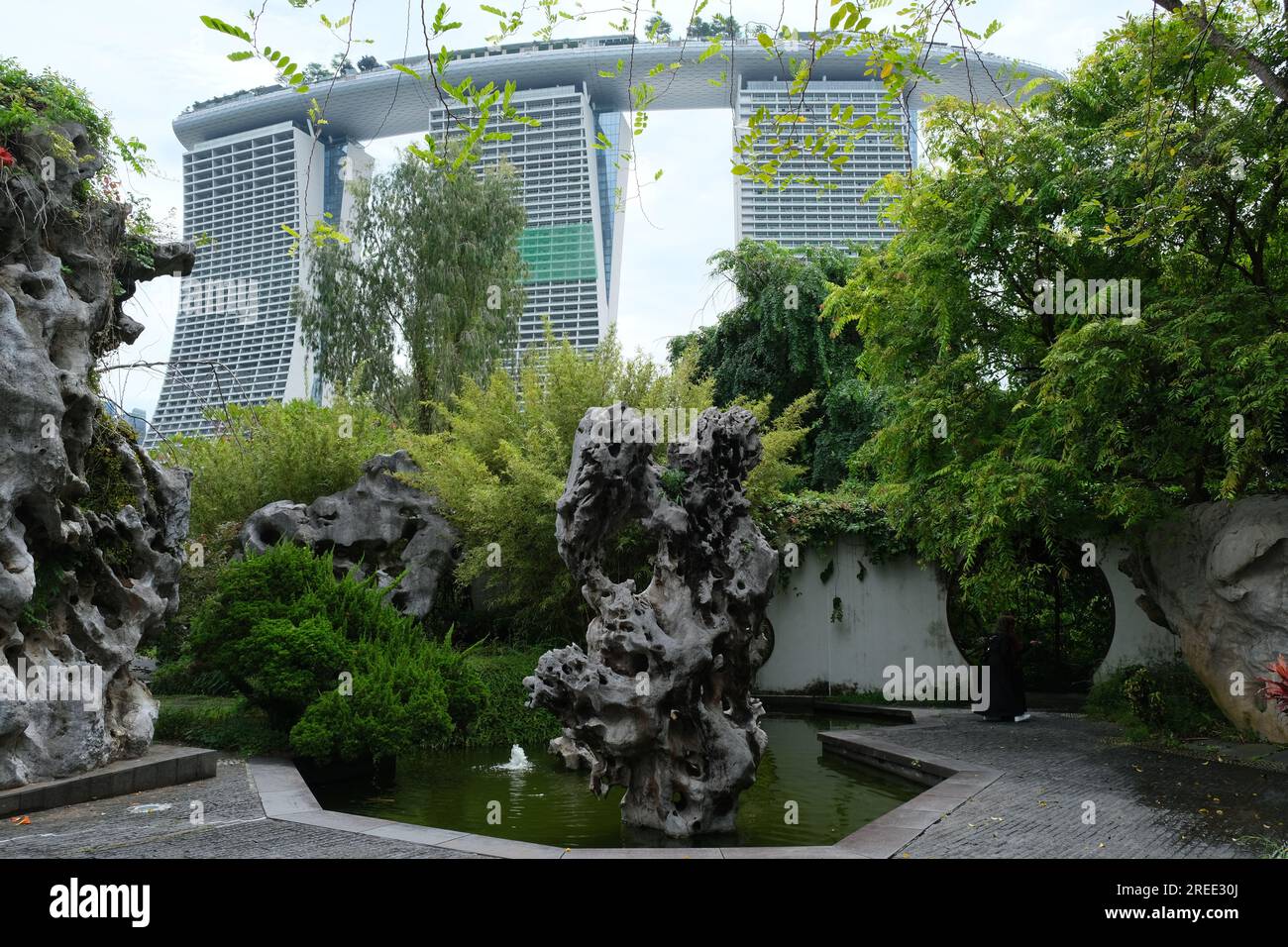 Singapore's Marina Bay Sands casino seen from traditional Chinese garden in the Gardens by the Bay Stock Photo
