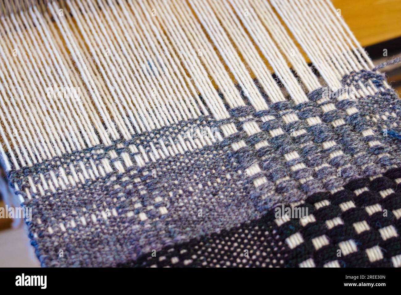 Close-up textile weaving with wool thread yarn on a loom Stock Photo ...