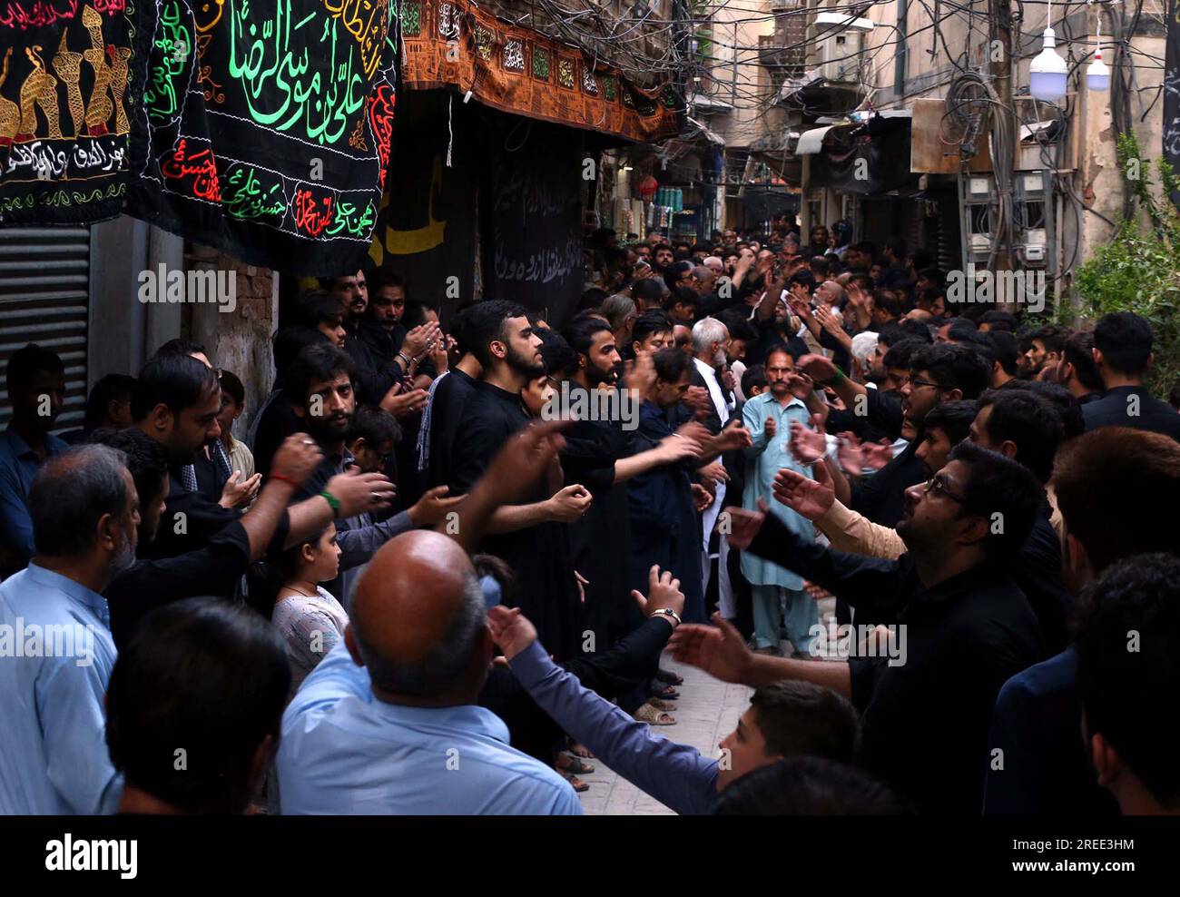 Devotees of Imam Hussain (A.S) are holding religious mourning procession in memories of martyrdom of Hazrat Imam Hussain (AS), grandson of Prophet Mohammad (PBUH), in connection of 8th Muharram-ul-Haram, at Qissa Khuwani Bazar in Peshawar on Thursday, July 27, 2023. Stock Photo