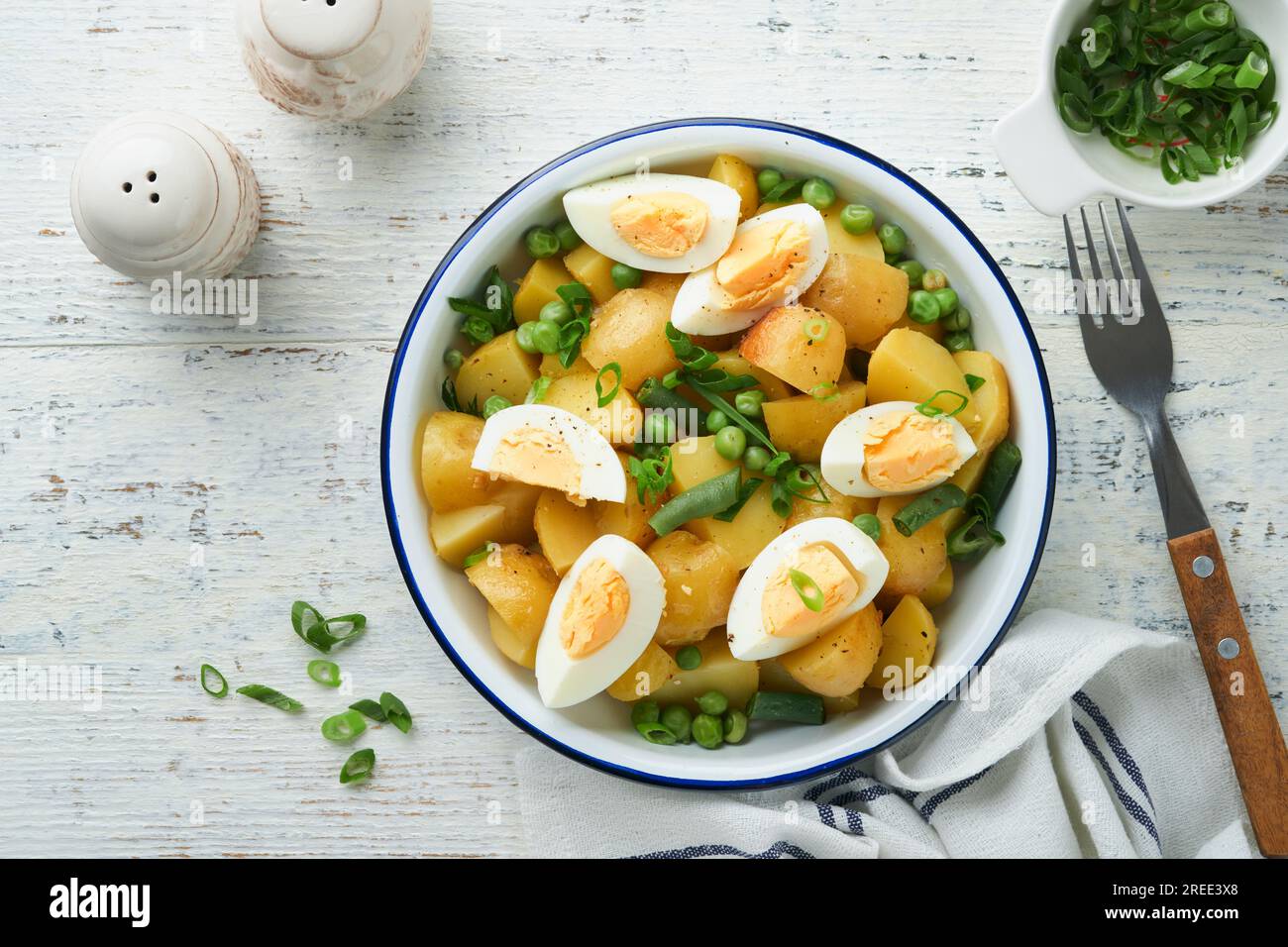 Traditional Potato salad with bacon and eggs in a white bowl. Picnic