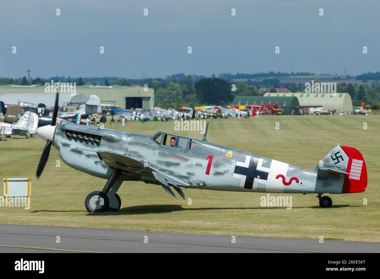 Hispano HA-1112 Buchon G-BWUE in Messerschmitt Me109, Luftwaffe fighter plane colours. Marked up as Hauptmann Werner Schroer's Bf 109G-2/trop 'Red 1' Stock Photo