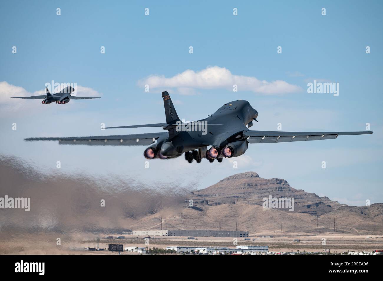 Two B-1B Lancers take off for a Weapons School Integration mission at Nellis Air Force Base, Nev. on May 30, 2023. Photo by William Lewis Stock Photo