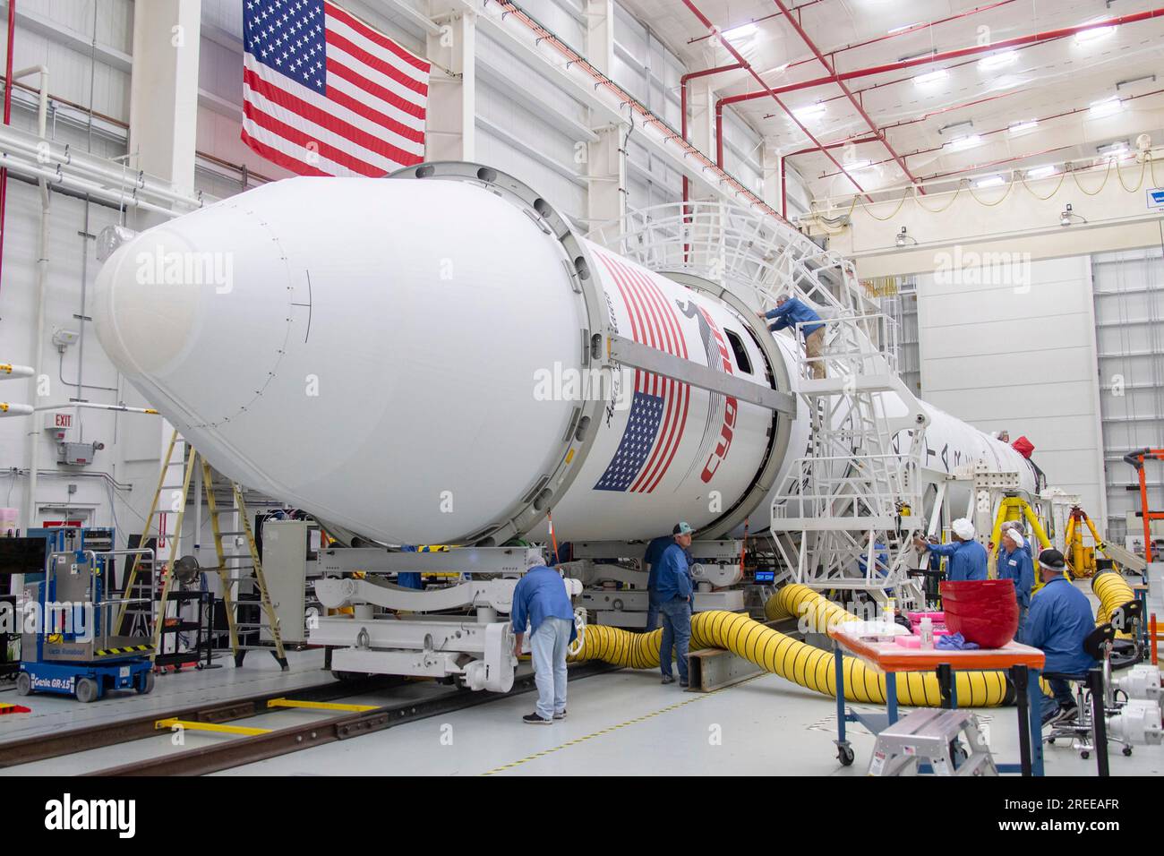 Wallops Island, United States of America. 26 July, 2023. Technicians attach the fairing to the Northrop Grumman Antares rocket carrying the unmanned Cygnus spacecraft at the Horizontal Integration Facility of the Mid-Atlantic Regional Spaceport of the NASA Wallops Flight Facility, July 26, 2023 in Wallops Island, Virginia, USA. The spacecraft will launch August 1st with 8,200 pounds of supplies for the International Space Station. Credit: Danielle Johnson/NASA/Alamy Live News Stock Photo