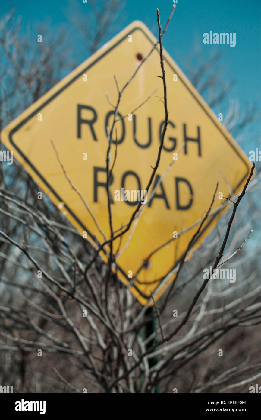 sign warns about a rough road ahead Stock Photo