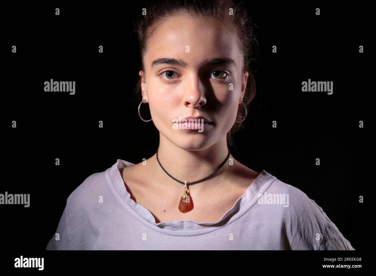 Portrait of a beautiful woman with black background Stock Photo - Alamy