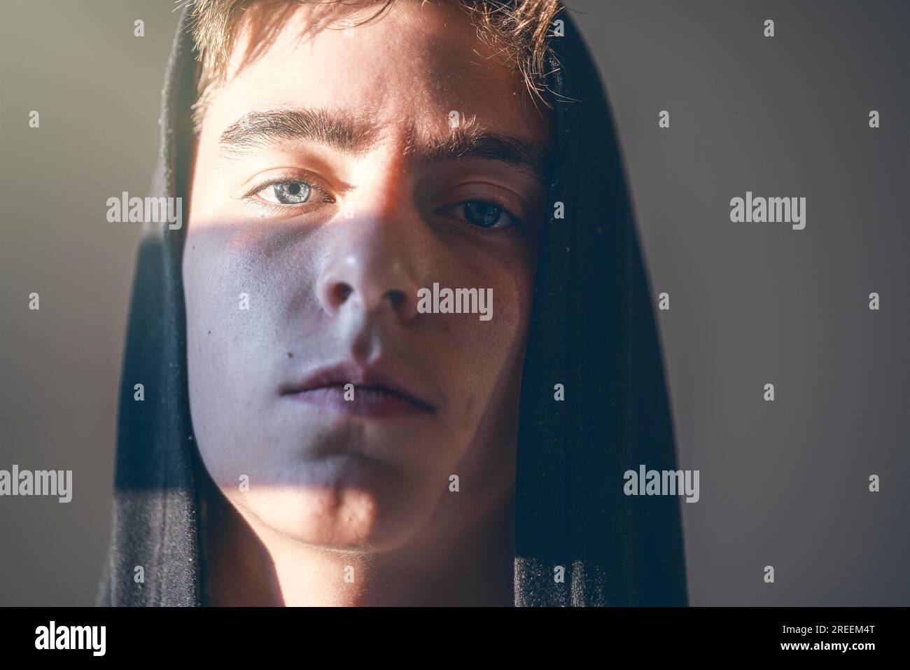 Close up portrait of a young man with hoodie Stock Photo