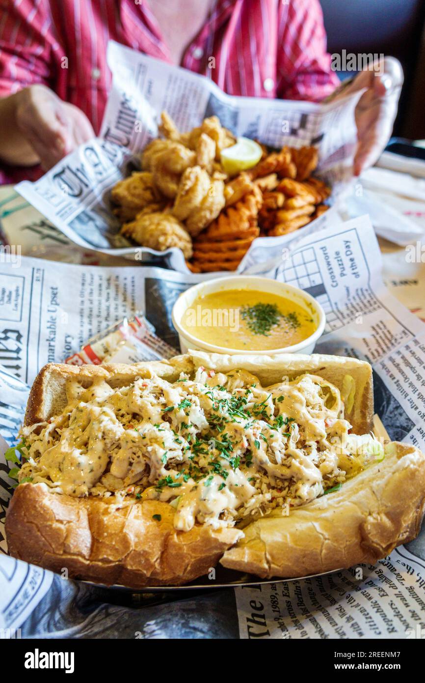 Athens Georgia,Hook & Reel Cajun Seafood and Bar restaurant,inside interior indoors,crabmeat roll crab bisque soup fried fish waffle fries lunch Stock Photo