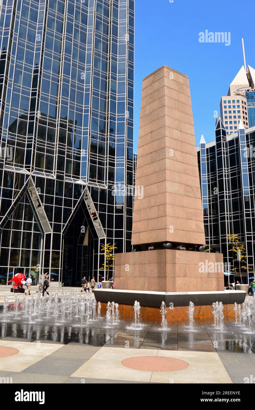Water fountains surround an obelisk in the center of PPG place in