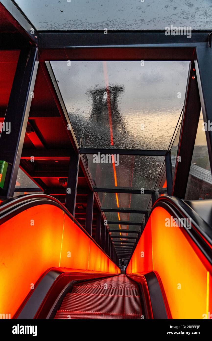 Zollverein colliery, rainy day, riding the escalator of the Ruhr Museum, in the coal washing plant, looking at the double trestle winding tower of sha Stock Photo