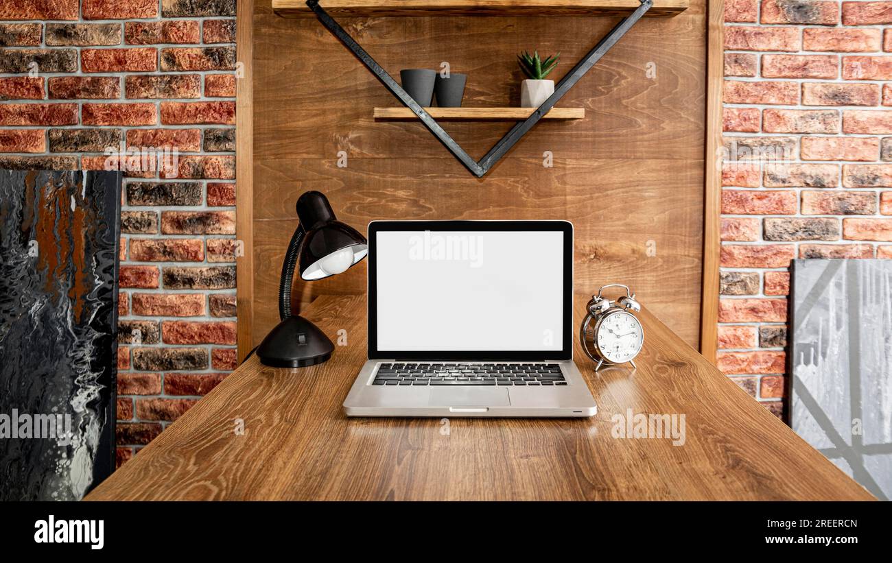Front view laptop office workspace with lamp Stock Photo