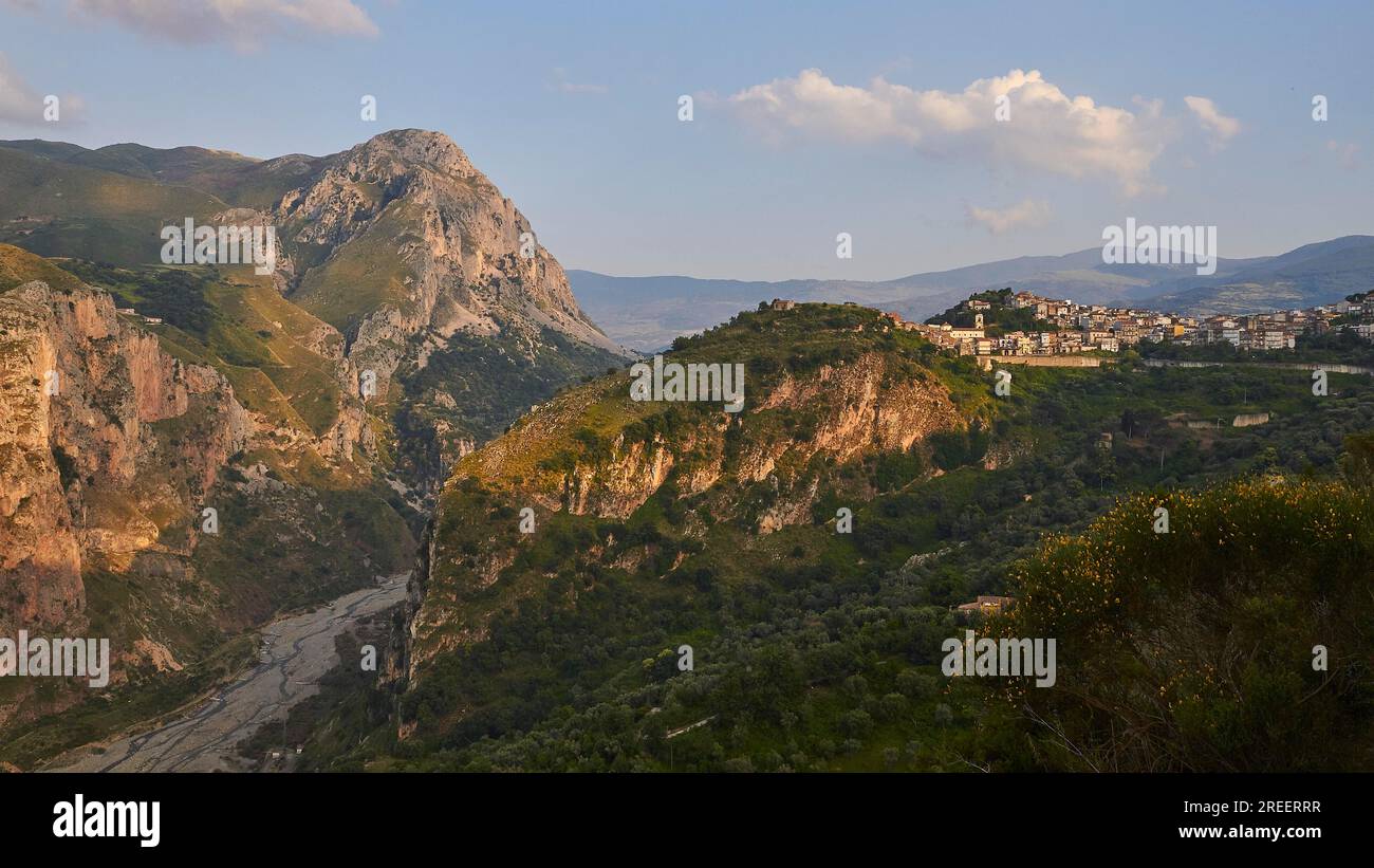 Evening light, gorge, mountain, village on hill, Militello Rosmarino, village, Nebrodi National Park, Sicily, Italy Stock Photo