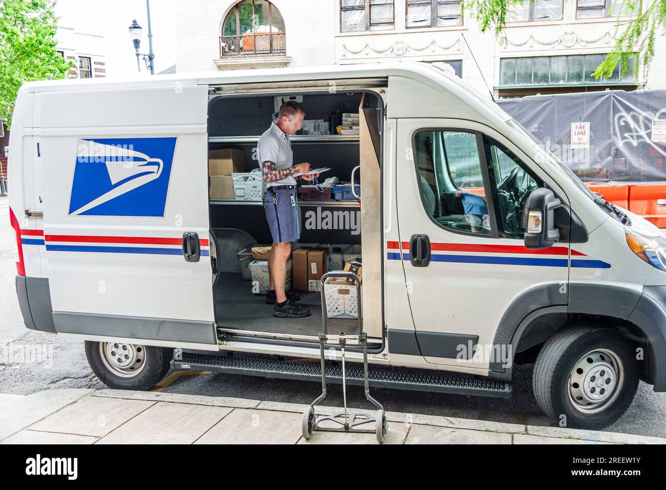 Asheville North Carolina,USPO post office parked van vehicle,mailman sorting mail delivering Stock Photo