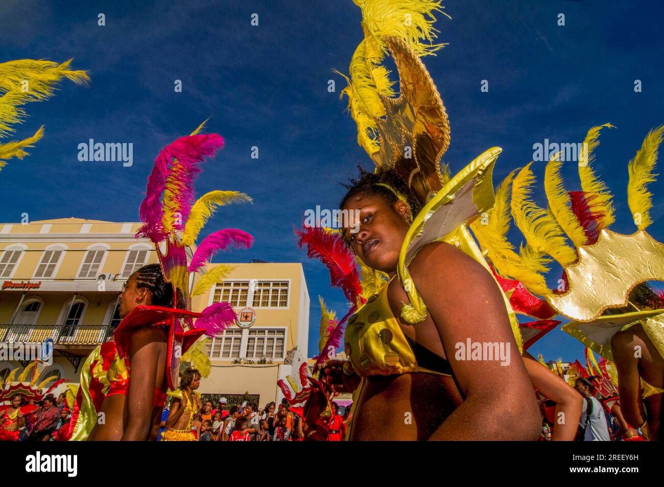 Colourful costumed, pretty women are dancing. Carnival. Mindelo. Cabo