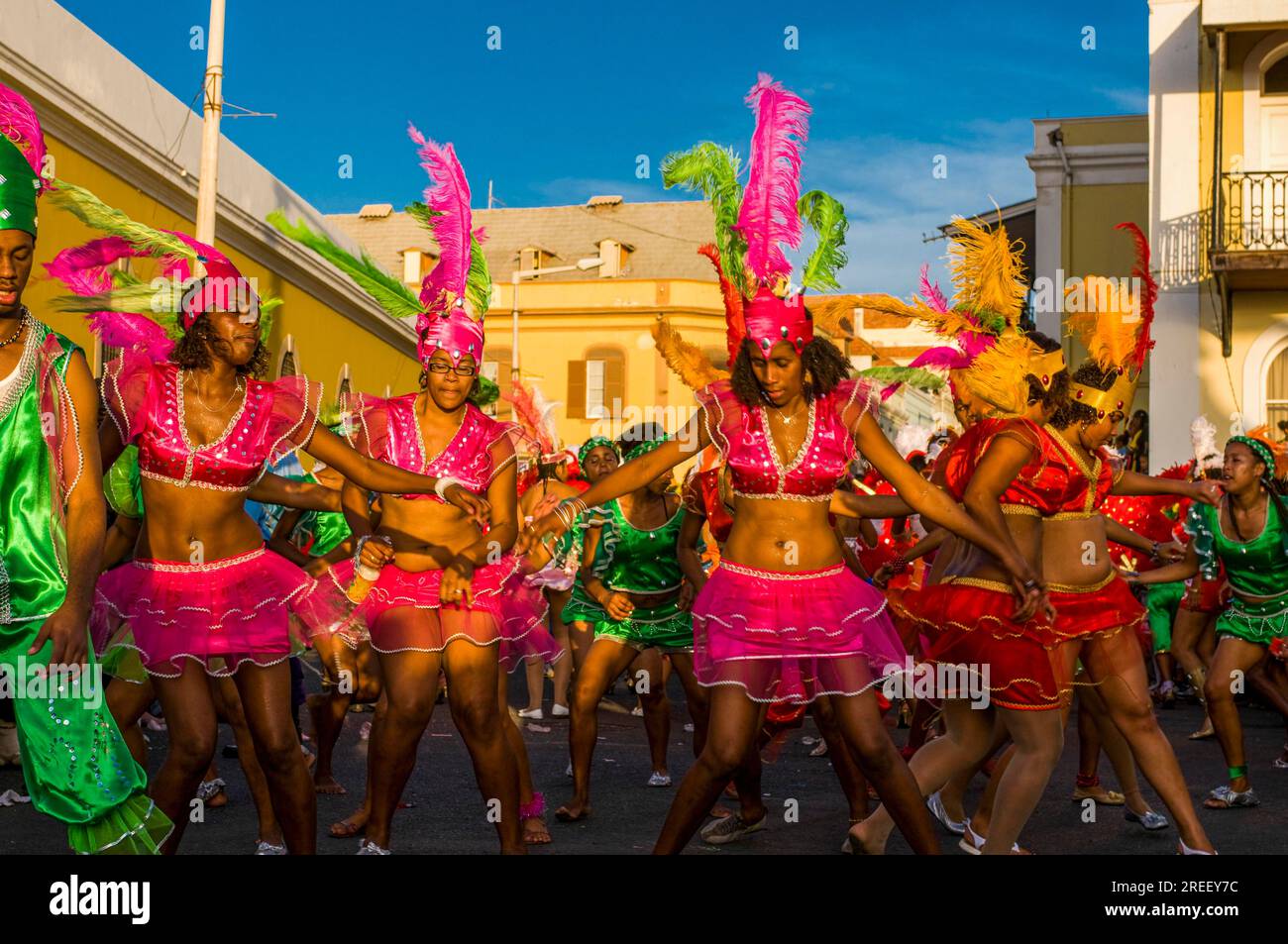 Colourful costumed, pretty women are dancing. Carnival. Mindelo. Cabo