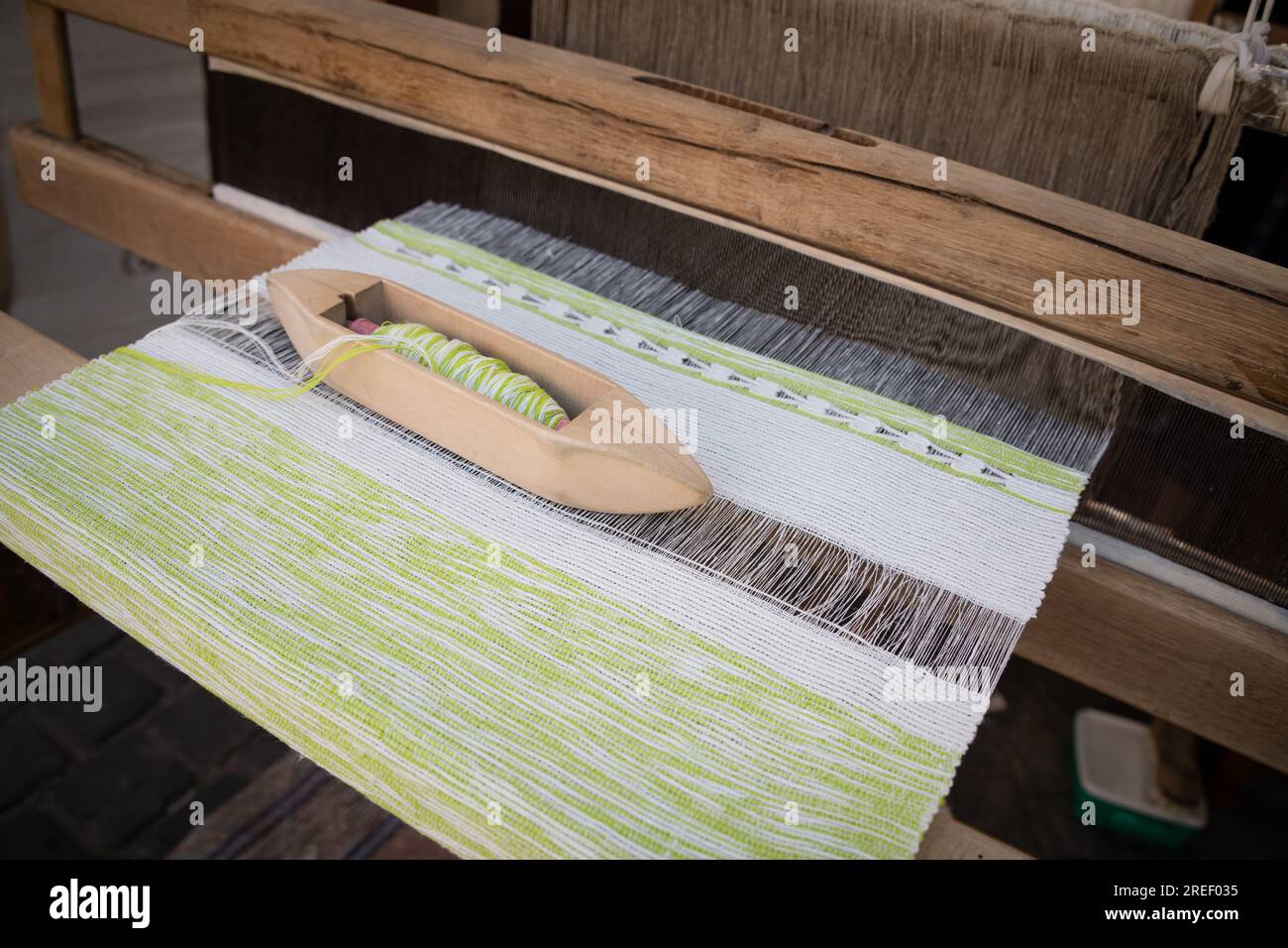 Processing of cotton on traditional wooden weaving loom Stock Photo - Alamy