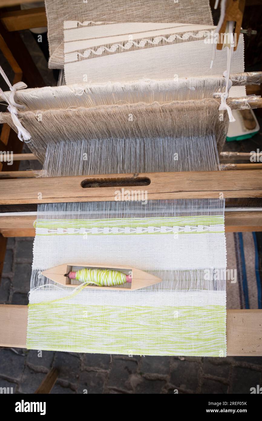 Processing of cotton on traditional wooden weaving loom Stock Photo - Alamy