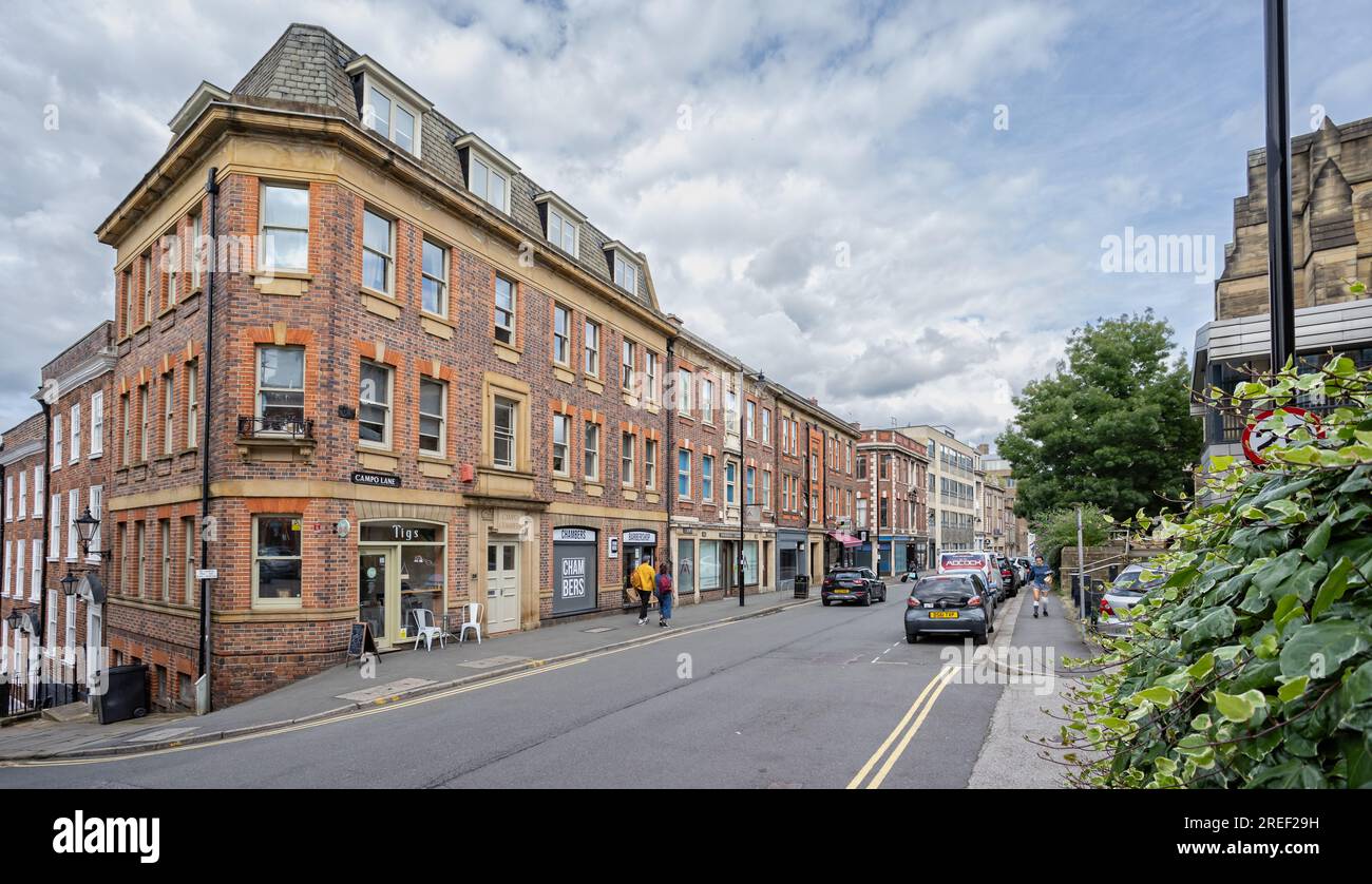 Red brick terraced house and shops on Campo Lane and the corner of Paradise Street in Sheffield, South Yorkshire, UK on 24 July 2023 Stock Photo