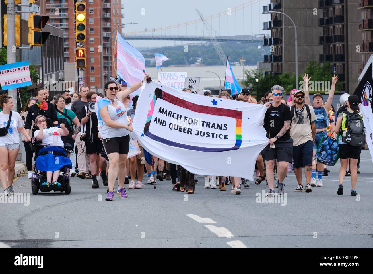 March for trans and Queer Justice of the Streets of Halifax Nova Scotia. Lead banner of crowd Stock Photo