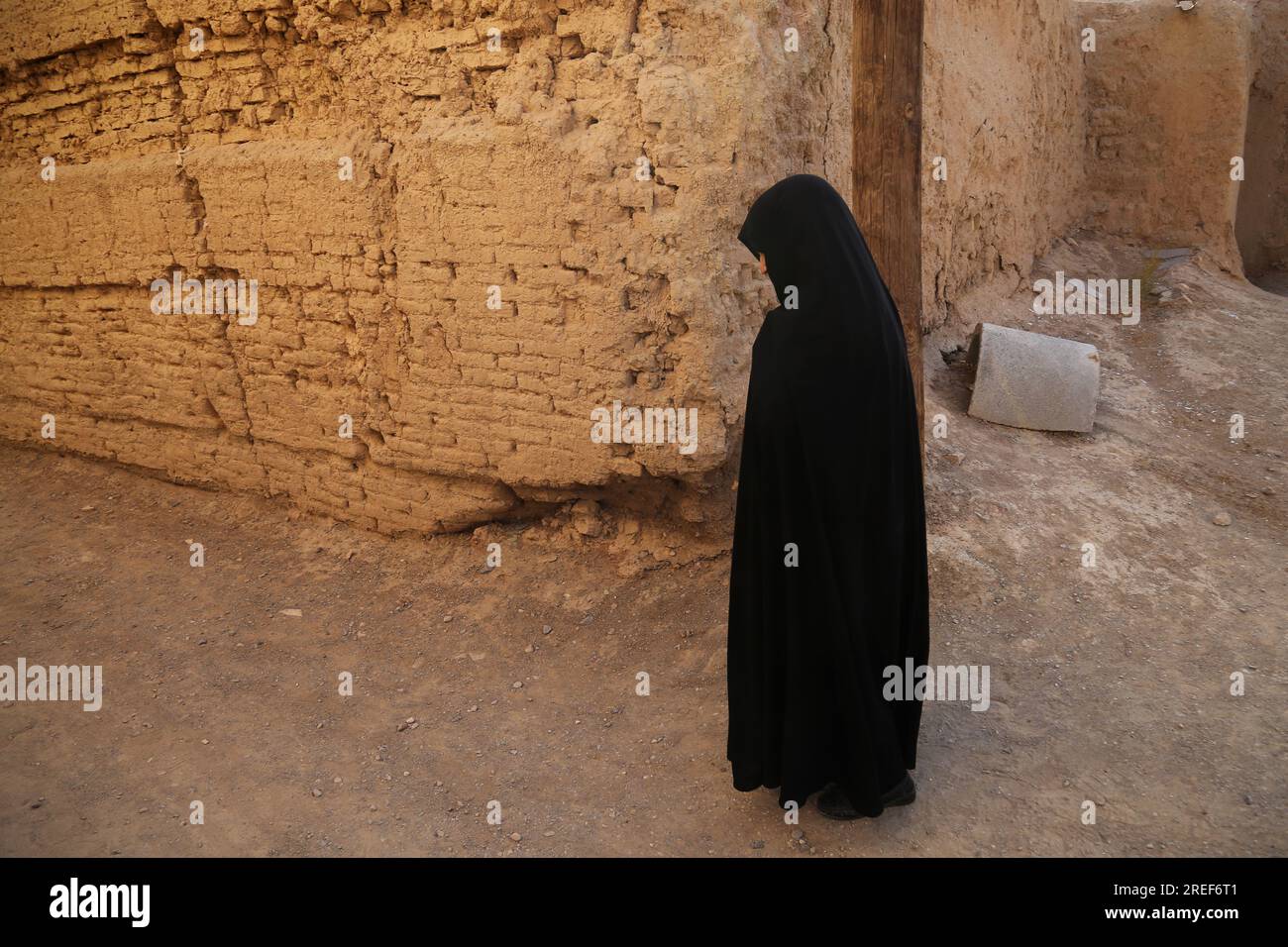 July 27, 2023, Qurtan village, Isfahan, Iran: An Iranian Shiite Muslim veiled woman walks before a religious ceremony marking the Muslim holy month of Muharram in the lead-up to Ashura in Qurtan village, near Isfahan. Ashura is a day of commemoration in Islam. It occurs annually on the 10th of Muharram, the first month of the Islamic calendar. Among Shia Muslims, Ashura is observed through large demonstrations of high-scale mourning as it marks the death of Husayn ibn Ali (a grandson of Muhammad), who was beheaded during the Battle of Karbala in 680 CE. (Credit Image: © Rouzbeh Fouladi/ZUMA Pr Stock Photo