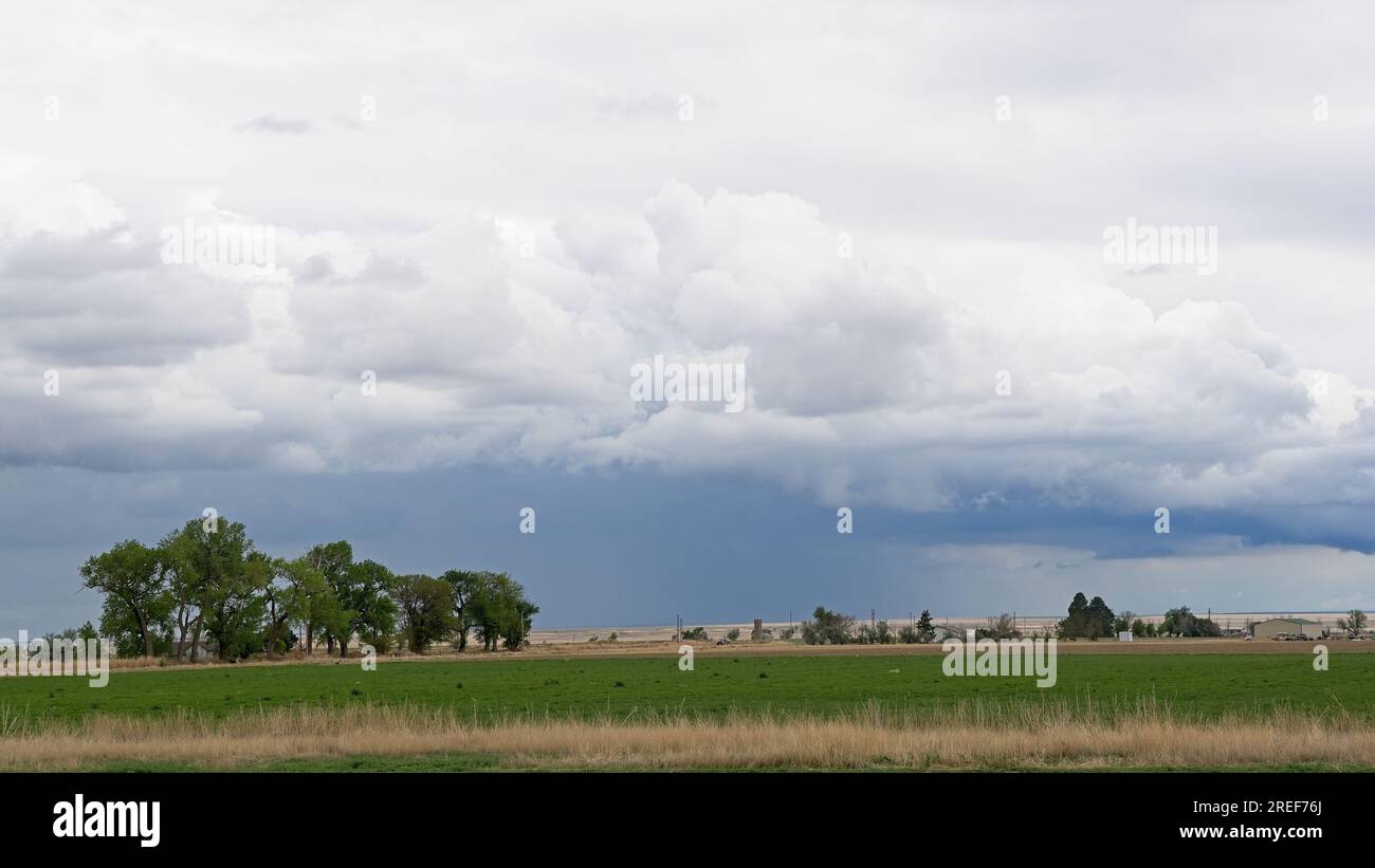 Ominous springtime storm clouds over Colorado farm land of the Great Plains outside Lamar Colorado Stock Photo