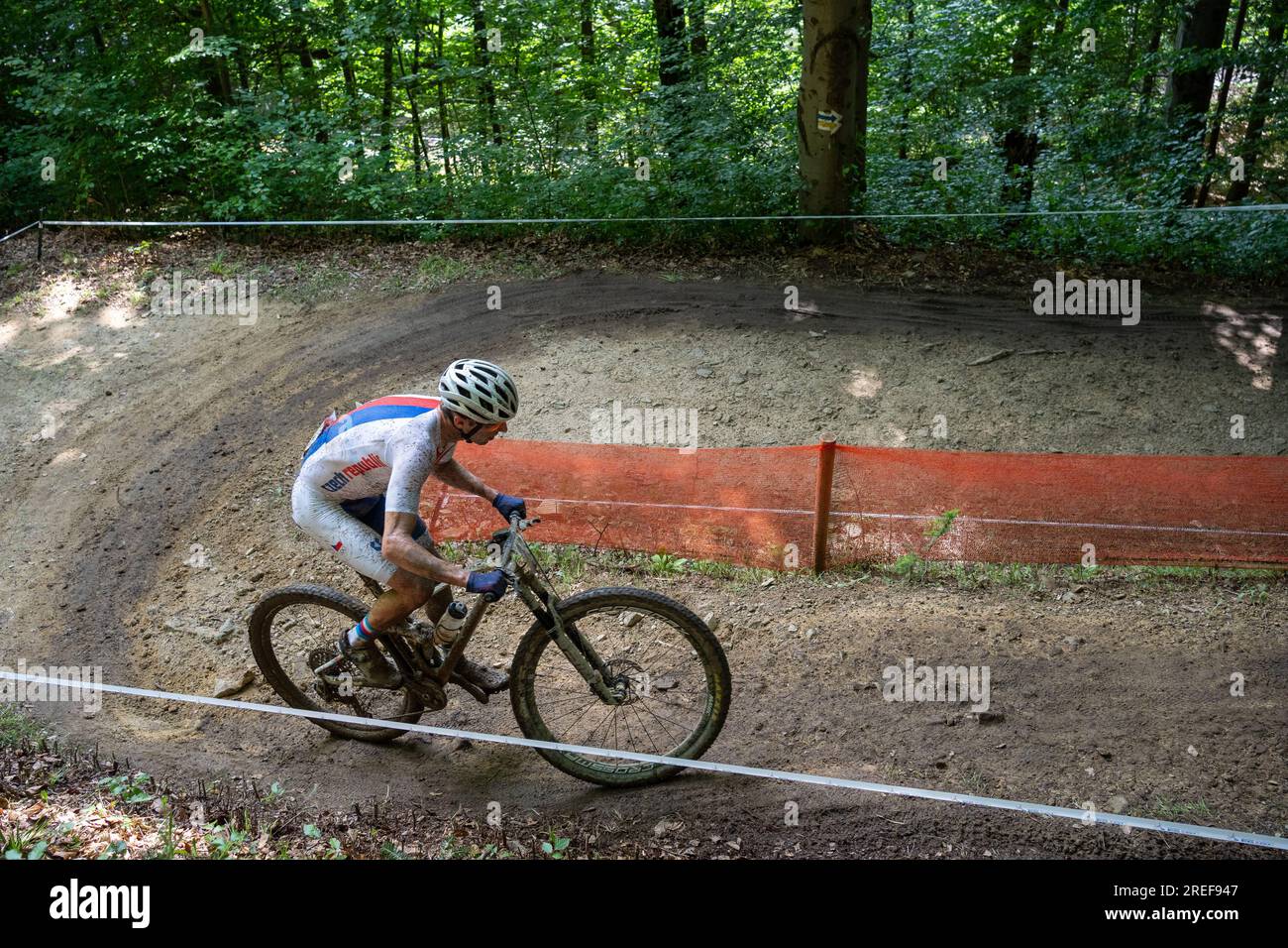 Cyclist pedaling uphill on forest hi-res stock photography and images ...