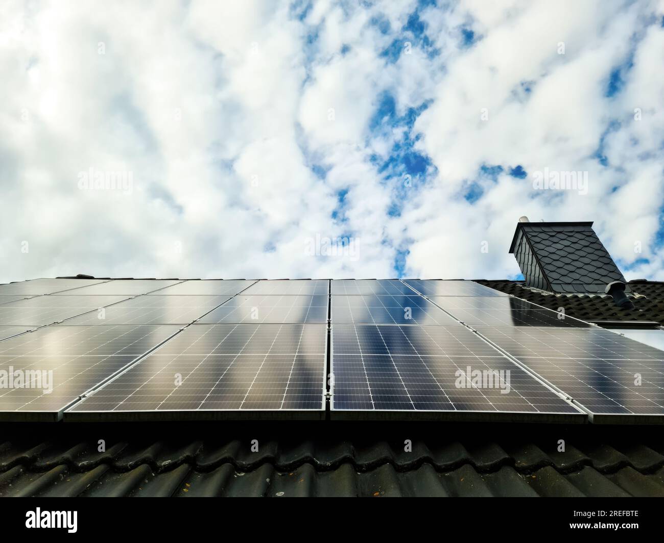 Solar panels producing clean energy on a roof of a residential house ...