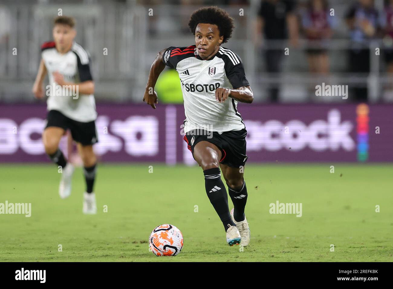 Orlando, Florida, USA. 26th July, 2023. Fulham midfielder WILLIAN BORGES DA SILVA (20) drives the ball during the second half of the Premier League Summer Series Fulham vs Aston Villa match at Exploria Stadium in Orlando, Fl on July 26, 2023. (Credit Image: © Cory Knowlton/ZUMA Press Wire) EDITORIAL USAGE ONLY! Not for Commercial USAGE! Stock Photo