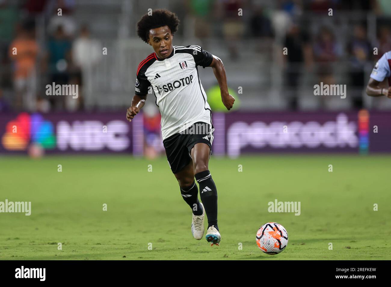 Orlando, Florida, USA. 26th July, 2023. Fulham midfielder WILLIAN BORGES DA SILVA (20) dribbles the ball during the second half of the Premier League Summer Series Fulham vs Aston Villa match at Exploria Stadium in Orlando, Fl on July 26, 2023. (Credit Image: © Cory Knowlton/ZUMA Press Wire) EDITORIAL USAGE ONLY! Not for Commercial USAGE! Stock Photo
