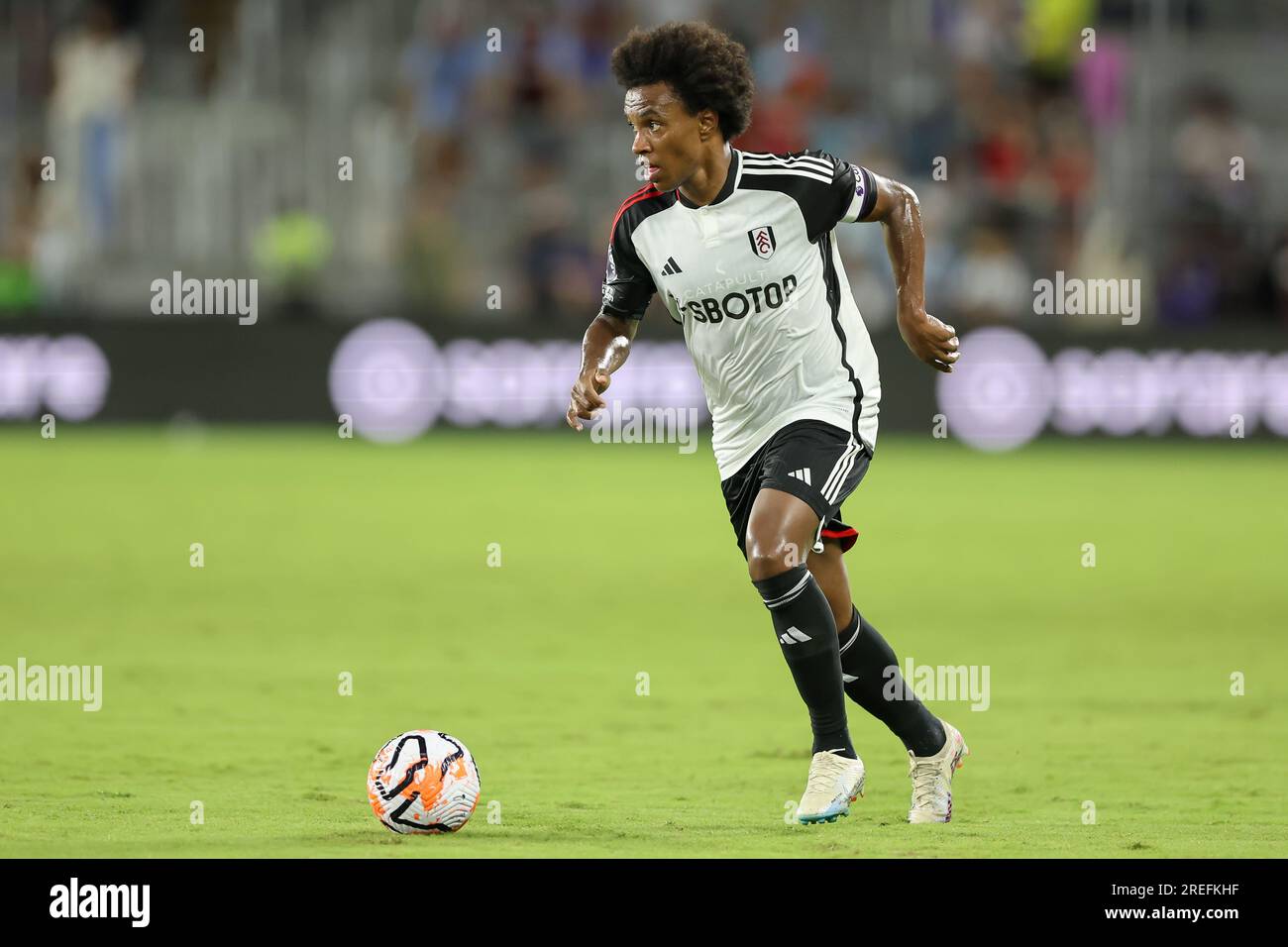 Orlando, Florida, USA. 26th July, 2023. Fulham midfielder WILLIAN BORGES DA SILVA (20) dribbles the ball during the second half of the Premier League Summer Series Fulham vs Aston Villa match at Exploria Stadium in Orlando, Fl on July 26, 2023. (Credit Image: © Cory Knowlton/ZUMA Press Wire) EDITORIAL USAGE ONLY! Not for Commercial USAGE! Stock Photo
