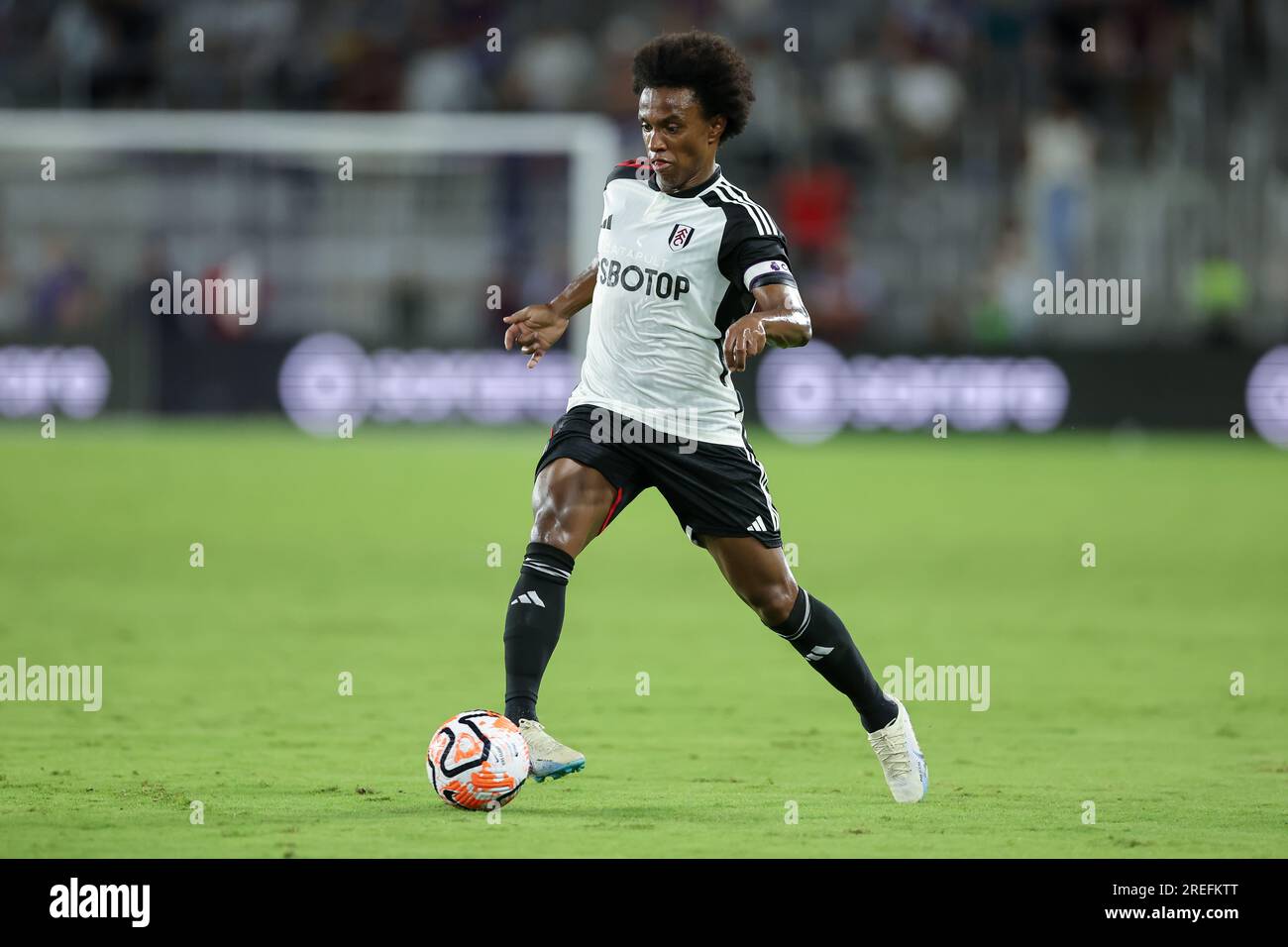 Orlando, Florida, USA. 26th July, 2023. Fulham midfielder WILLIAN BORGES DA SILVA (20) passes the ball during the second half of the Premier League Summer Series Fulham vs Aston Villa match at Exploria Stadium in Orlando, Fl on July 26, 2023. (Credit Image: © Cory Knowlton/ZUMA Press Wire) EDITORIAL USAGE ONLY! Not for Commercial USAGE! Stock Photo