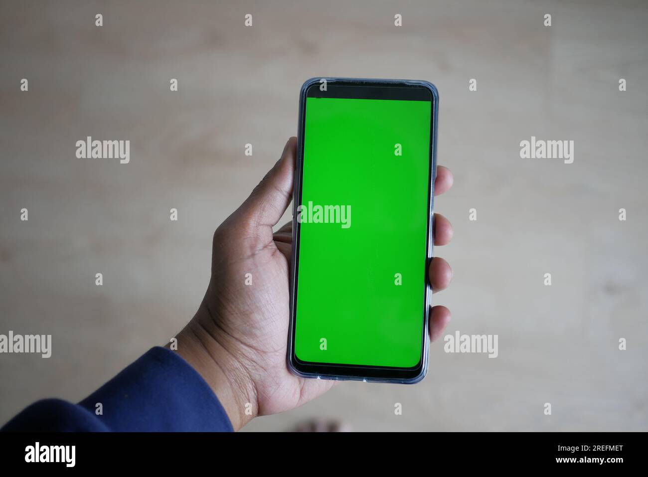 Close up of young man hand using smart phone with green screen Stock ...