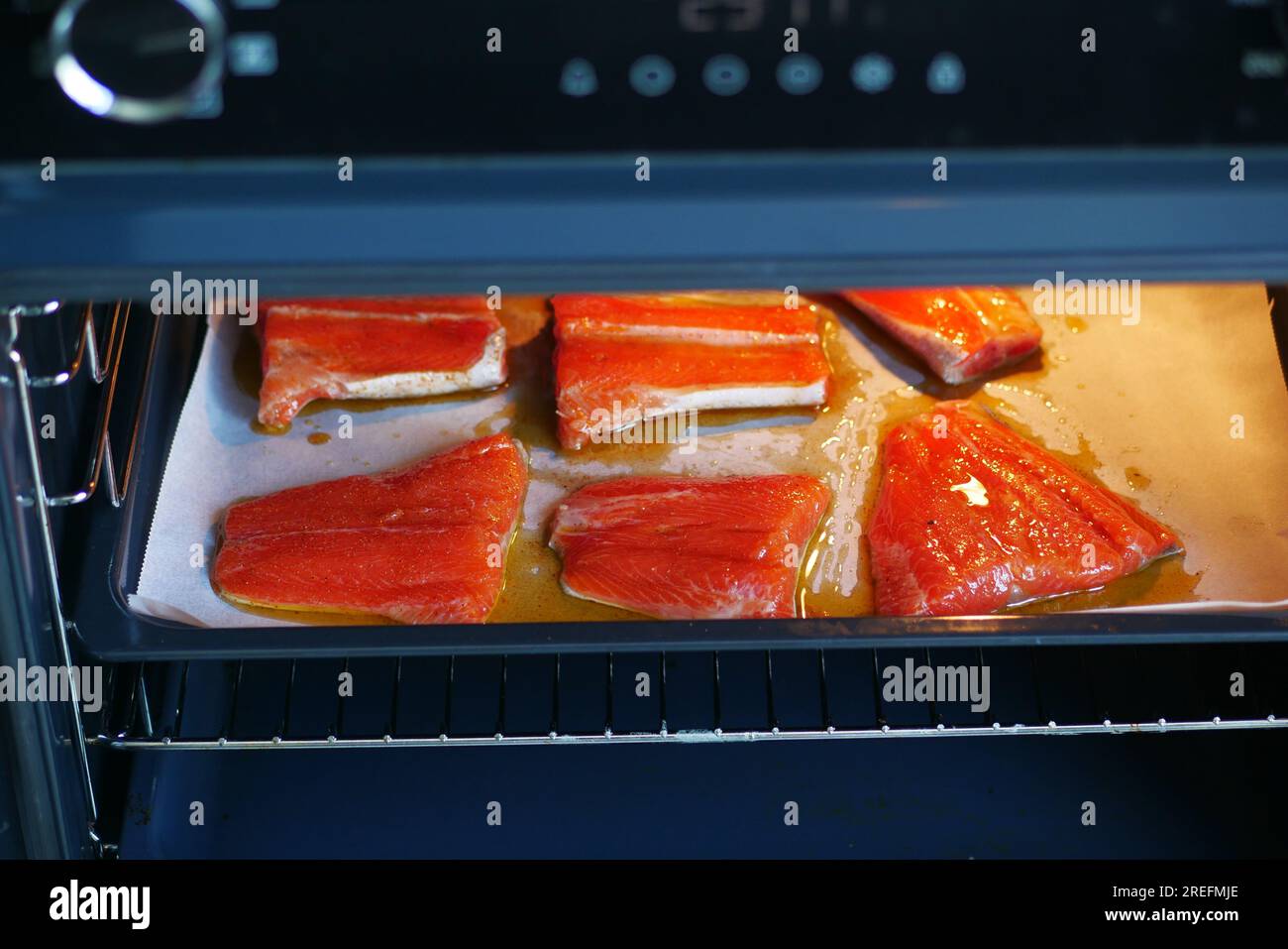 baked salmon fish in open electric oven at home Stock Photo Alamy