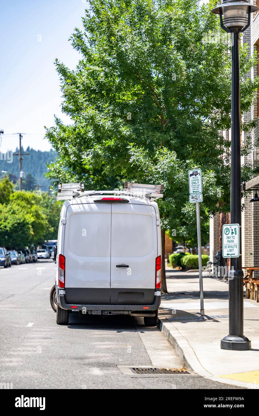 White compact light duty maneuverable economical cargo mini van with